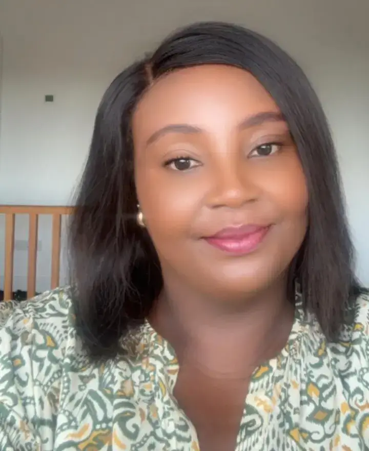 Smiling woman wearing patterned blouse