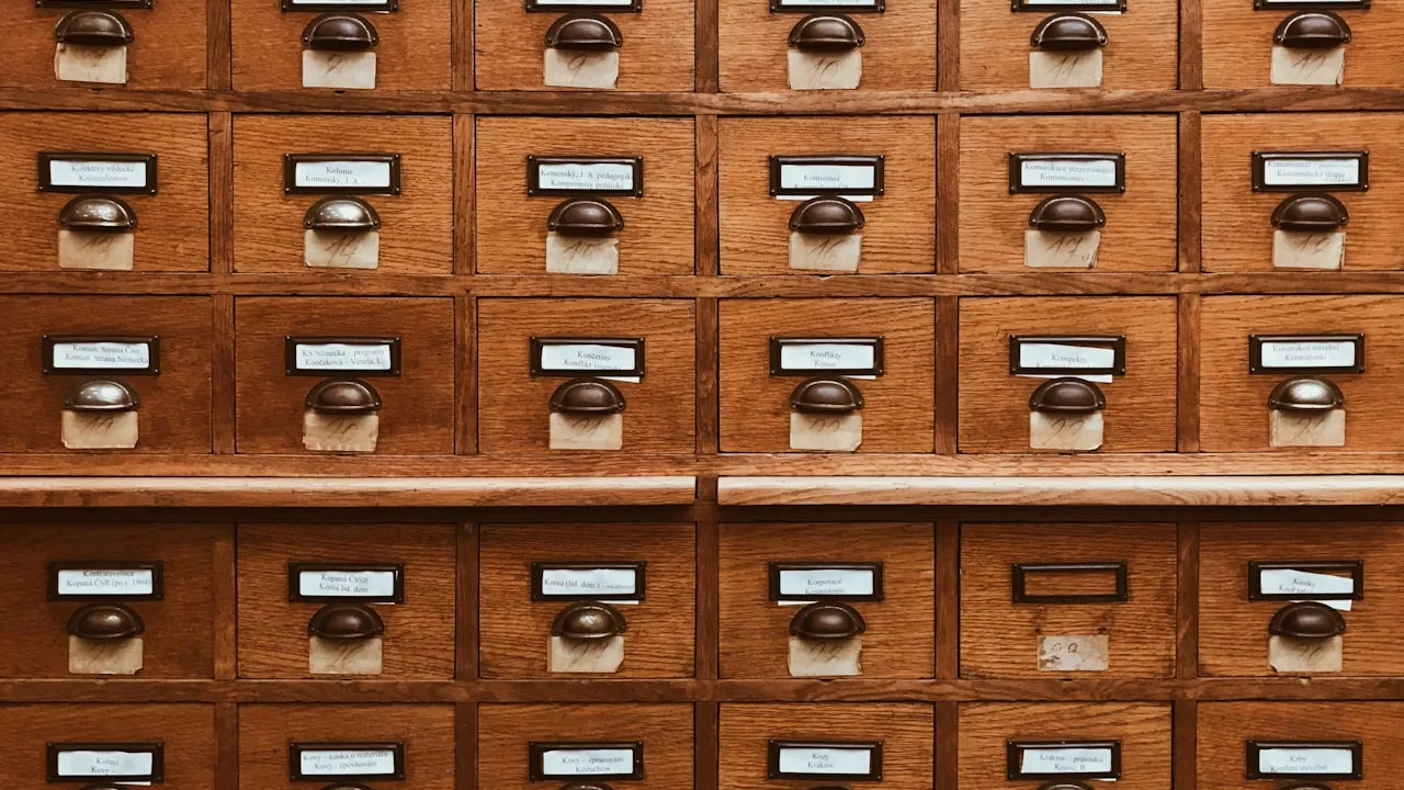 Wooden library card catalogue drawers.