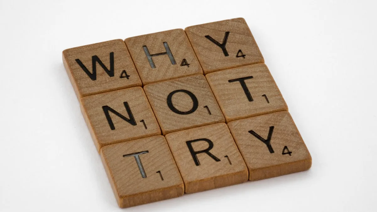 Scrabble tiles spelling 'Why Not Try'