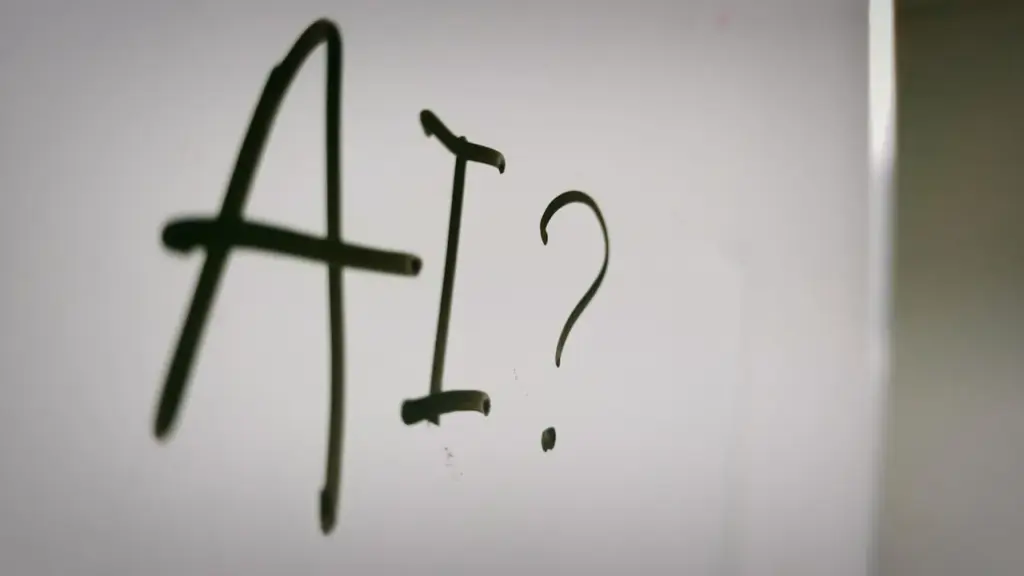 AI written on glass with question mark